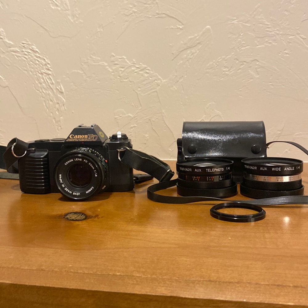 Canon T50, lens adapter, 2 extra lenses with lenses case.